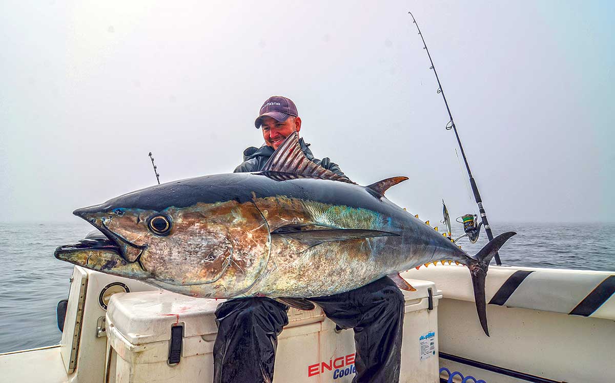 Angler fighting a tuna on spinning tackle